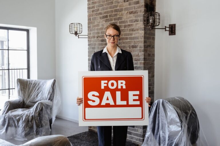 For sale sign in front of a house for real estate