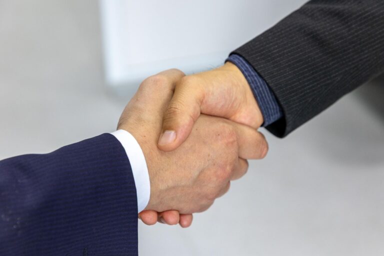 Professional handshake conveying trust and expertise